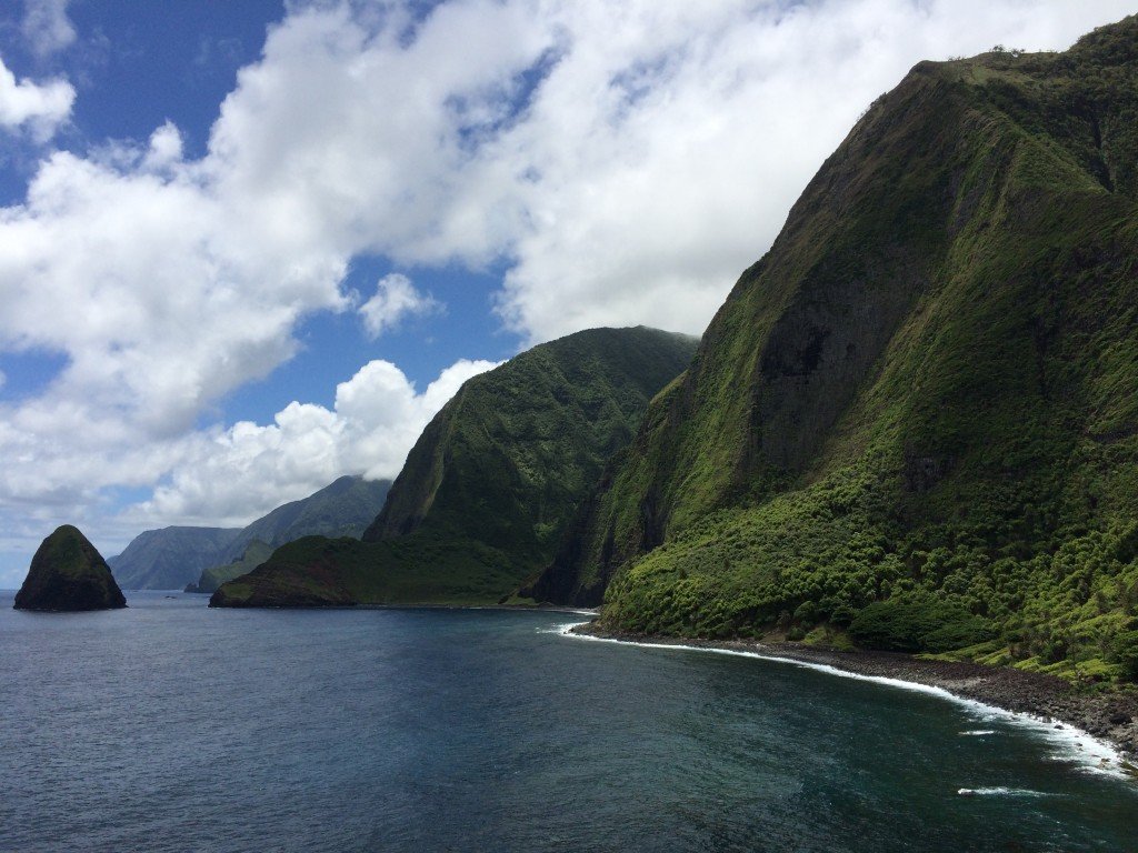 Open Molokaʻi land with sea cliffs and ranch country above the Pacific